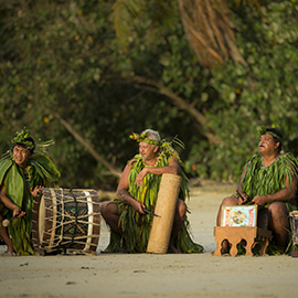 Polynesian drummers wearing traditional cloths